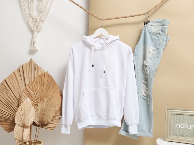 White hoodie with blue jeans